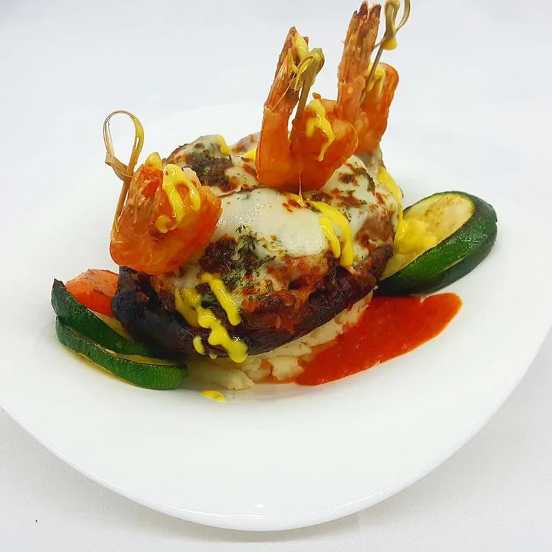 Shrimp and steak stack plated