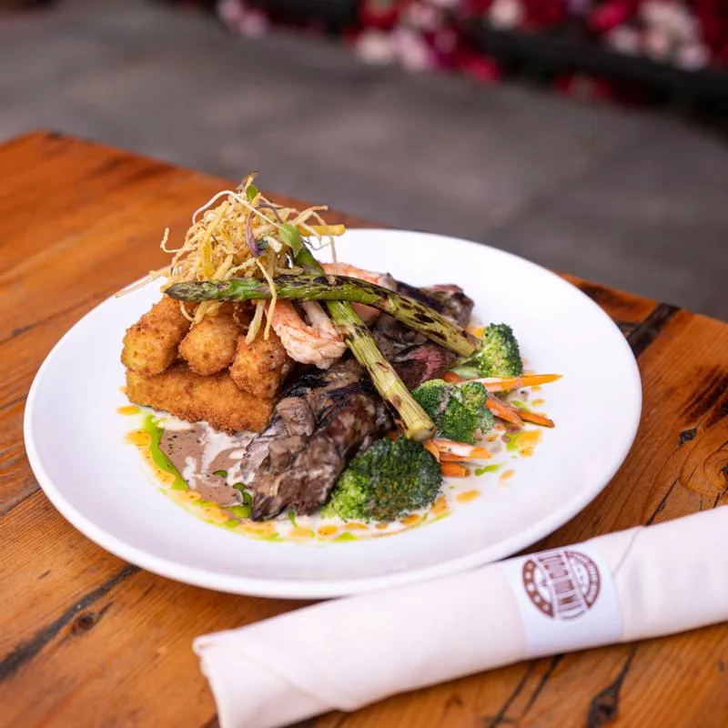 Shrimp and steak stack with branded napkin